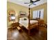 Charming bedroom with wood flooring and a four-poster bed at 2222 N Val Vista Dr # 3, Mesa, AZ 85213