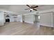 Open concept living room with kitchen view and access to backyard at 887 W Shannon St, Chandler, AZ 85225