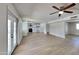 Open concept living room with kitchen view and access to backyard at 887 W Shannon St, Chandler, AZ 85225