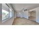 Bright and spacious living room with wood-look flooring and ceiling fan at 887 W Shannon St, Chandler, AZ 85225