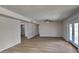 Bright and spacious living room with wood-look flooring and ceiling fan at 887 W Shannon St, Chandler, AZ 85225