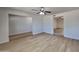 Bright and spacious living room with wood-look flooring and ceiling fan at 887 W Shannon St, Chandler, AZ 85225
