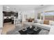 Open-concept living and dining area adjacent to the kitchen at 23387 W Albeniz Pl, Buckeye, AZ 85326