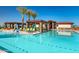 Resort-style swimming pool with comfortable lounge chairs and umbrellas at 24741 N 175Th Dr, Surprise, AZ 85387