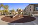 Community playground with playset and safe, soft surface at 158 W Commerce Ct, Gilbert, AZ 85233