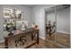 Home office with desk, large mirror and window at 158 W Commerce Ct, Gilbert, AZ 85233