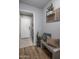 Neat entryway with bench, storage, and washer/dryer at 158 W Commerce Ct, Gilbert, AZ 85233