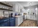 Modern kitchen with white cabinets and blue island at 158 W Commerce Ct, Gilbert, AZ 85233