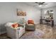 Living room with two armchairs and a home office area at 158 W Commerce Ct, Gilbert, AZ 85233