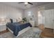 Modern bedroom with a large bed and stylish geometric wallpaper at 158 W Commerce Ct, Gilbert, AZ 85233