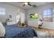 Bright bedroom with a large bed, dresser, and plenty of closet space at 158 W Commerce Ct, Gilbert, AZ 85233