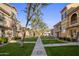 Inviting community courtyard with well-manicured lawns and walking paths at 158 W Commerce Ct, Gilbert, AZ 85233