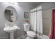 Clean bathroom with toilet, shower/tub, and sink at 158 W Commerce Ct, Gilbert, AZ 85233