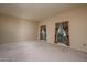 Relaxing living room with neutral carpet and ample natural light at 10829 W Hibiscus Dr, Sun City, AZ 85373