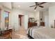 Comfortable bedroom with striped bedding and ensuite bathroom at 21613 N 261St Ave, Buckeye, AZ 85396