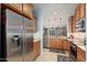 Kitchen with granite countertops, stainless steel appliances, and light wood cabinets at 21613 N 261St Ave, Buckeye, AZ 85396