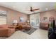 Relaxing living room with a sofa, seating area and backyard access at 21613 N 261St Ave, Buckeye, AZ 85396