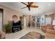 Comfortable living room with a view into the kitchen and breakfast bar at 21613 N 261St Ave, Buckeye, AZ 85396