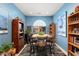 Bright dining area with built-in shelving and a wood table at 21613 N 261St Ave, Buckeye, AZ 85396