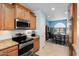 Kitchen with granite countertops, stainless steel appliances, and light wood cabinets at 21613 N 261St Ave, Buckeye, AZ 85396