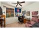 Home office with a desk, chair, and ceiling fan at 21613 N 261St Ave, Buckeye, AZ 85396