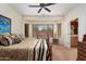 Spacious main bedroom with large windows and a ceiling fan at 21613 N 261St Ave, Buckeye, AZ 85396