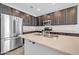 Modern kitchen with stainless steel appliances and island at 13115 W Tether Trl, Peoria, AZ 85383