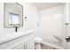 Updated bathroom with a walk-in shower, modern vanity, and white tile at 10263 W Snead S Cir, Sun City, AZ 85351