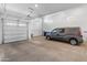 Spacious two-car garage with high ceilings and ample storage space at 24741 N 175Th Dr, Surprise, AZ 85387