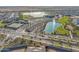 Aerial view of community amenities including a lake, tennis courts, and clubhouse at 24741 N 175Th Dr, Surprise, AZ 85387