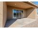 Covered patio with sliding glass doors leading to backyard at 24741 N 175Th Dr, Surprise, AZ 85387