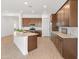 Well-equipped kitchen with granite countertops and dark wood cabinets at 24741 N 175Th Dr, Surprise, AZ 85387