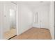 Bright entryway with mirror reflecting bathroom and door to outside at 24741 N 175Th Dr, Surprise, AZ 85387