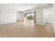 Bright and airy living room with sliding glass doors leading to backyard at 24741 N 175Th Dr, Surprise, AZ 85387