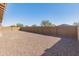 Large backyard with gravel landscaping and block wall at 24741 N 175Th Dr, Surprise, AZ 85387