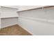 Large walk-in closet with double hanging rods at 24741 N 175Th Dr, Surprise, AZ 85387