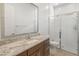 Clean bathroom with granite vanity and a large walk-in shower at 24741 N 175Th Dr, Surprise, AZ 85387