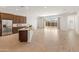 Open concept kitchen and living area with wood look tile flooring at 24741 N 175Th Dr, Surprise, AZ 85387