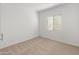 Simple bedroom with neutral colored carpet and window coverings at 24741 N 175Th Dr, Surprise, AZ 85387