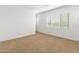 Simple bedroom with neutral walls and carpet at 24741 N 175Th Dr, Surprise, AZ 85387