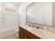 Modern bathroom boasts granite countertops and a large mirror at 24741 N 175Th Dr, Surprise, AZ 85387