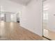 Open living room with wood-look floors and view to backyard at 24741 N 175Th Dr, Surprise, AZ 85387
