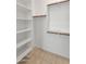 Bright walk-in closet with shelving and hanging rods at 24741 N 175Th Dr, Surprise, AZ 85387