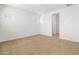 Spacious bedroom with neutral carpeting and an ensuite bathroom at 24741 N 175Th Dr, Surprise, AZ 85387