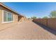 Spacious backyard with gravel and a view of the house at 24741 N 175Th Dr, Surprise, AZ 85387