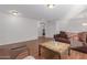 Sitting area with brown leather sofa and wicker chair at 955 S Henry Ln, Gilbert, AZ 85296
