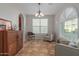 Cozy dining area with tile floors and a wooden cabinet at 955 S Henry Ln, Gilbert, AZ 85296