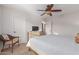 Bright bedroom with a comfortable bed, ceiling fan, and ample closet space at 955 S Henry Ln, Gilbert, AZ 85296