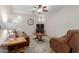 Gathering room with a brown leather couch and chair at 955 S Henry Ln, Gilbert, AZ 85296
