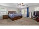 Main bedroom with wood platform bed, nightstands, and TV stand at 955 S Henry Ln, Gilbert, AZ 85296